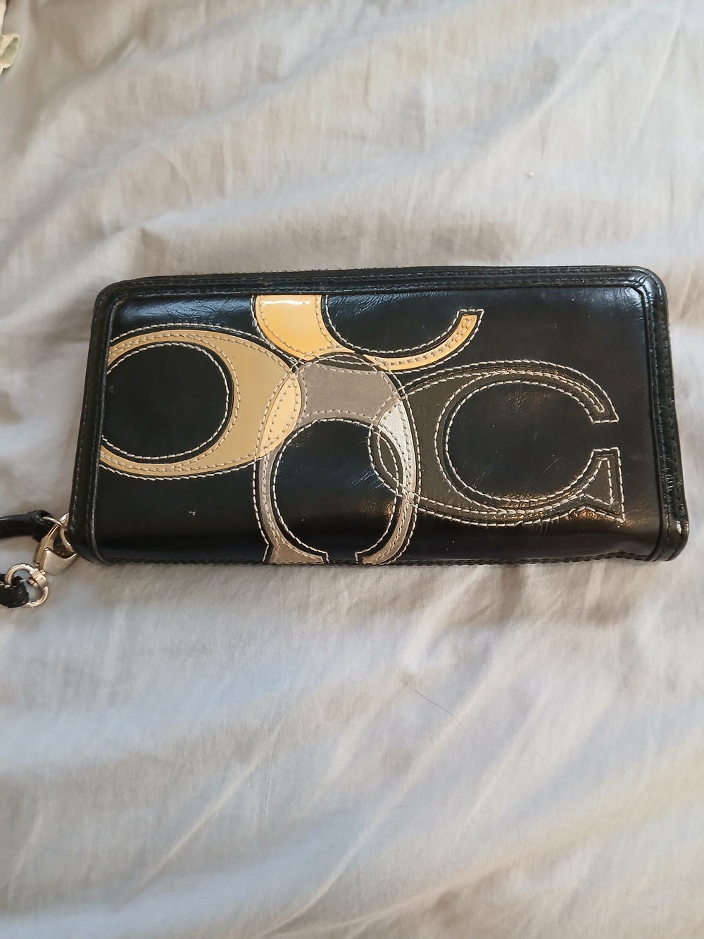 Coach Black Leather Clutch with Tan and Cream Logo Appliqué